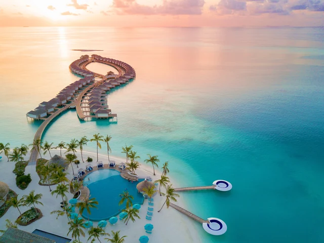 Aerial view of Kandima Maldives, with its beach, lagoon, and overwater villas. Photo: Kandima Maldives.